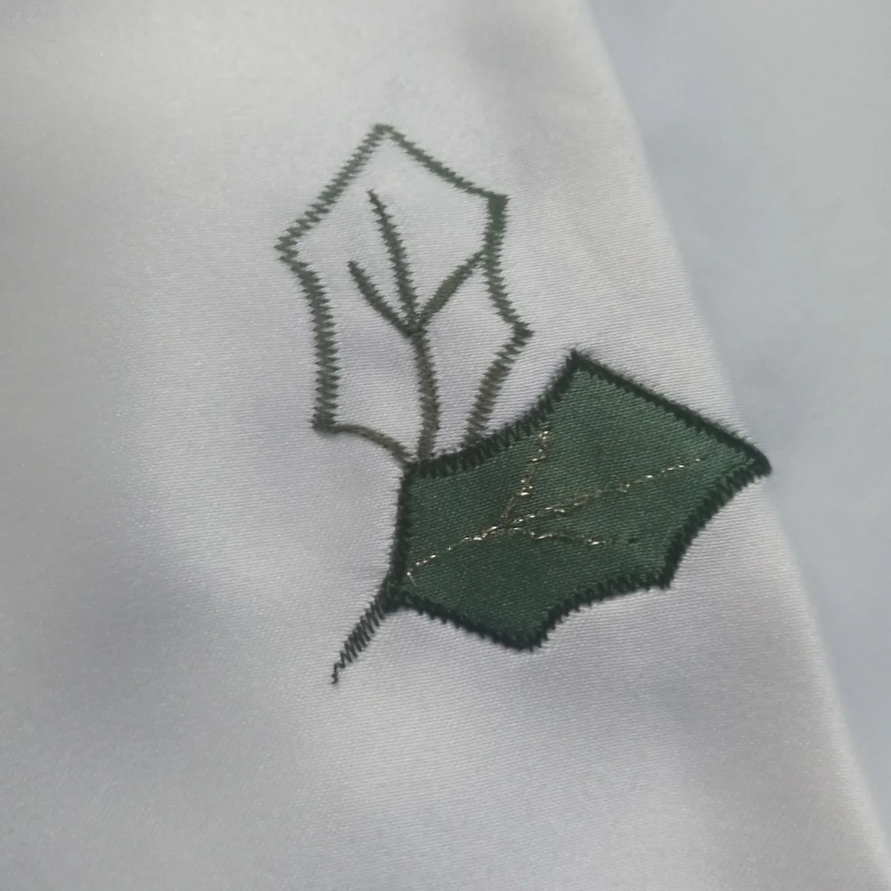 St. Nicolas Square Christmas 4 Cloth Napkins Satin feel Embroidered Holly Leaves
